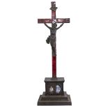 A 19th century cast-iron and enamel crucifix, height 61cm Enamel is chipped with several small