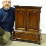 A Georgian mahogany collector's cabinet of small size, with 2 fielded arch panelled doors