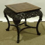A 19th century Chinese hardwood square centre table, with beaded edge and relief carved and