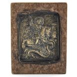 A miniature Greek bronze relief cast icon depicting George and the Dragon, set in a stained wood