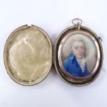A Georgian miniature watercolour on ivory, portrait of a gentleman wearing a blue coat with