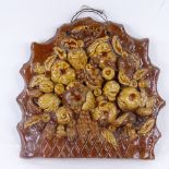 A 19th century handmade Devon Pottery wall-hanging relief plaque depicting fruit, impressed Devon,