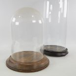 3 glass domes on turned wood bases, largest height 52cm (3) Glass is all perfect, no cracks. This