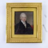 An early 19th century miniature watercolour on ivory, half-length portrait of a gentleman wearing