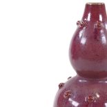 A Chinese red glaze porcelain double-gourd vase, incised marks under base, height 24cm Good
