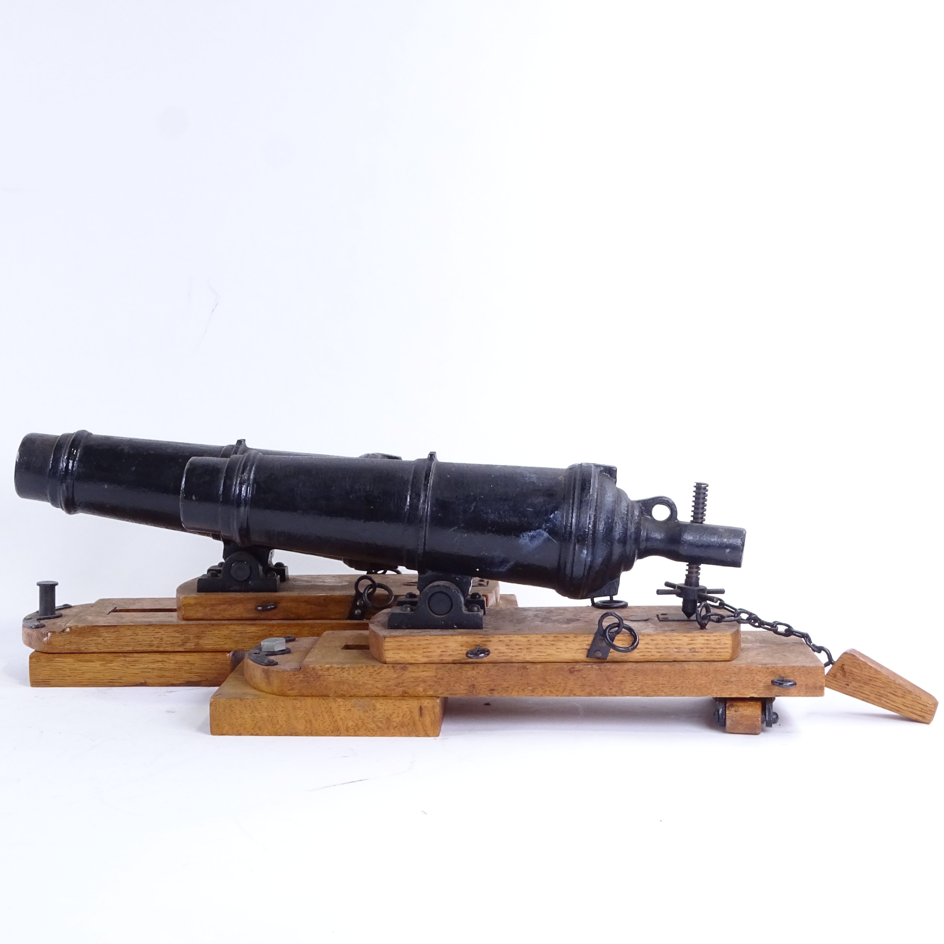 A pair of cast-iron barrelled model cannons on stained oak stands, overall barrel length 28cm, - Image 3 of 3