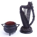 A Victorian Irish bog oak harp, and a pin cushion cauldron, harp height 14cm. Cauldron is in good