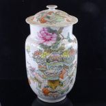 A Chinese Qianjiang cai enamelled Antiquity jar and cover, decorated with various antiques to one