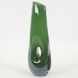 VICKE LINDSTRAND FOR KOSTA, SWEDEN, designed 1953, tall pierced vase in cased green glass, marked to