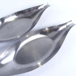 TINTINHULL, Stainless Steel fruit bowls circa 1970s', in stylised elongated form, length 50cm.
