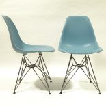 CHARLES EAMES, VITRA, a pair of blue coloured DSR side chairs, with plastic shell seat on powder