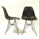 CHARLES EAMES, VITRA, a pair of black coloured DSR side chairs, with plastic shell seat on powder