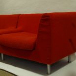 HABITAT, A pair of two seater sofas, covered in red looped cotton/wool fabric, makers label,