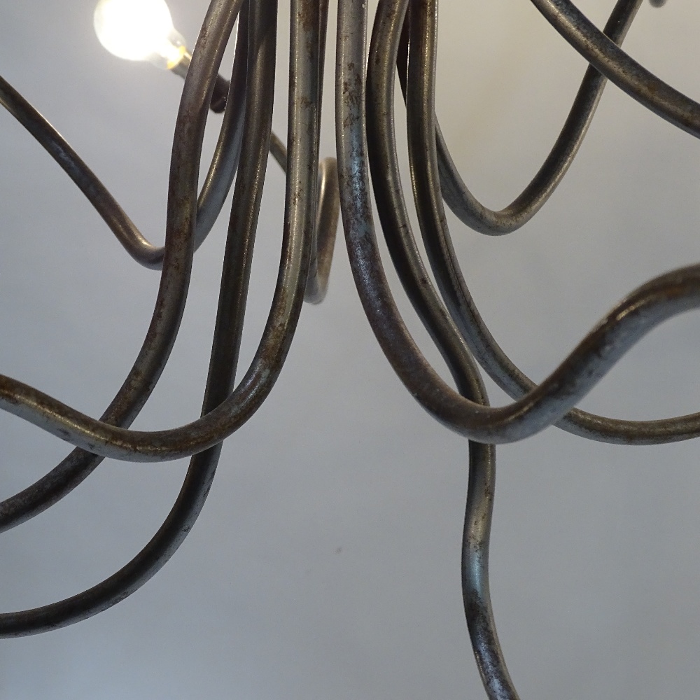 A 1980s' 10 branch chandelier, in the manner of RON ARAD, an abstract form constructed of raw - Image 4 of 4