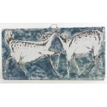 A Scandinavian mid-century ceramic wall plaque, with abstract horse design, length 49cm. Surface