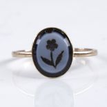 A 19th century unmarked gold intaglio banded agate seal ring, depicting flower, with closed-back