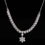 A modern 9ct white gold diamond floral necklace, set with eight-cut diamonds in illusion style