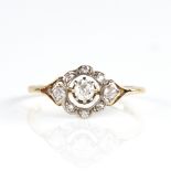 An early 20th century 18ct gold diamond halo cluster ring, total diamond content approx 0.25ct,