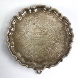 A Victorian silver salver, circular form with scalloped rim, floral and foliate engraved