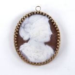A 19th century relief carved shell cameo pendant, depicting Classical female profile, in unmarked