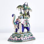 An early 20th century Indian unmarked silver and enamel caparisoned elephant model, with howdah