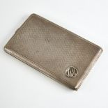 A George V rectangular silver cigarette case, allover engine turned decoration with gilt interior,