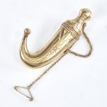 A Persian unmarked gold Jambiya dagger brooch, opening to reveal blade, engraved decoration,