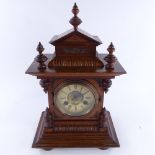 An early 20th century mahogany-cased 8-day architectural mantel clock, examined by Benet Fink & Co