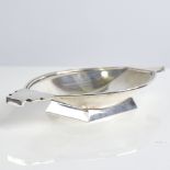 A small Art Deco silver bon bon dish, geometric design with stepped handles and pedestal base, by