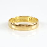 A mid-20th century 22ct gold wedding band ring, retailed by Bravingtons, hallmarks London 1964, band