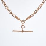 A modern unmarked 9ct rose gold fancy link double Albert chain necklace, elongated double-bar and