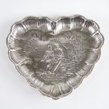 A late 19th/early 20th century German silver heart-shaped dish, Hanau, relief embossed lover