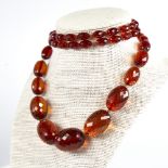 A Vintage graduate single-row faceted amber bead necklace, beads measuring from 29.8mm to 11.5mm,