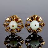 A pair of Chinese 14ct gold polished jade sphere clip earrings, earring diameter 22mm, 13.6g Both in