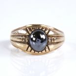 A large 9ct gold cabochon haematite and paste signet ring, setting height 13.1mm, size X, 6.9g