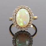A large late 20th century 18ct gold cabochon opal and diamond cluster ring, set with oval cabochon