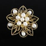 A Vintage Singaporean 14ct gold pearl floral brooch/pendant, openwork rope twist decoration with