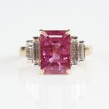 A modern unmarked gold rubellite tourmaline and baguette-cut diamond ring, set with emerald-cut
