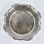 An Elizabeth II circular silver card salver, cast foliate rim, by James Dixon & Sons, hallmarks