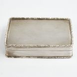 A George V silver snuffbox, plain rectangular form with cast floral border and allover engine turned