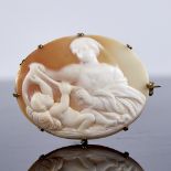 A Victorian relief carved shell cameo brooch, depicting mother and child, in unmarked gilt-metal