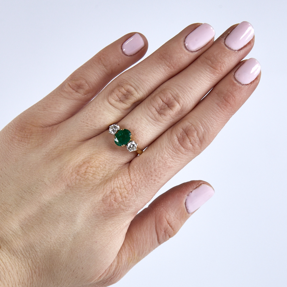 A mid-20th century unmarked high carat gold 3-stone emerald and diamond ring, set with oval mixed- - Image 5 of 5