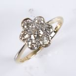 An early 20th century 18ct gold diamond cluster flowerhead ring, set with old-cut diamonds and