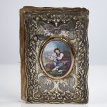 A 19th century Continental unmarked silver lady's notecase, allover relief embossed and engraved