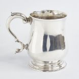 A George III silver christening tankard mug, baluster form with scrolled acanthus leaf handle,