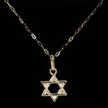 A modern 9ct gold Star of David pendant necklace, on 9ct trace link chain, pendant height