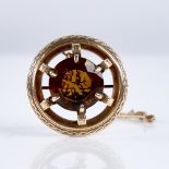 A 19th century Scottish Celtic unmarked gold and citrine target brooch, set with large round-cut