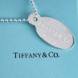 TIFFIANY & CO - a modern sterling silver Return To Tiffany oval pendant necklace, on original silver