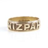 A late 19th century 18ct gold Mizpah band ring, textured half-band decoration with raised lettering,