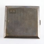 A George V Art Deco silver cigarette case, square form with wavey engine turned decoration and